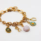Composition charms sur base bracelet mailles ovales de la gamme GRIGRI - L'Atelier des Dames