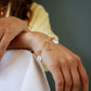 Bijoux dorés - Composition charms portée sur une base bracelet mailles rectangles - charms ancre, chiffre 3, coeur nacre - L'Atelier des Dames